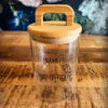 Gepersonaliseerde Voorraadpot  Hondensnacks – Stijlvol, handig én met de naam van jouw hond erop! Bewaar de favoriete snacks van je viervoeter in stijl met onze Gepersonaliseerde Voorraadpot  Hondensnacks! Deze mooie glazen pot met een bamboe deksel staat prachtig op het aanrecht én houdt de snoepjes lekker vers. Het leukste? Wij graveren de naam van jouw hond er gratis op – zo heeft je hond z’n eigen snackpot! Waarom je deze Gepersonaliseerde Voorraadpot Hondensnacks wilt hebben: Gepersonaliseerd met naam – Superleuk én uniek! Stijlvol design – Glazen pot met strak bamboe deksel, past in elk interieur.  Ideaal voor hondensnoepjes – Houdt traktaties vers en netjes opgeborgen. Top cadeau – Voor elke hondenliefhebber (of jezelf 😉). Een echte eyecatcher in huis én mega handig! Bestel nu jouw gepersonaliseerde voorraadpot en verras je hond met zijn eigen snackspot!  Maak snacktijd nóg specialer met onze Gepersonaliseerde Voorraadpot Hondensnacks! Shop je deze leuke voorraadpot voor hondensnacks? Dan personaliseren we deze gratis met de naam van jouw hond! Deze gepersonaliseerde voorraadpot voor hondensnacks is een echte eyecatcher en past perfect in jouw keuken of hondenhoek. Dankzij de handige deksel kun je snel en makkelijk bij de snacks, zelfs als jouw hond al kwispelend naast je staat te wachten. Geen gedoe, gewoon lekker makkelijk! De voorraadpot is gemaakt van glas en voorzien van een houten deksel. De luchtdichte afsluiting houdt snacks vers en knapperig, precies zoals jouw hond ze het liefst heeft. Geef jouw hond het luxe gevoel van een eigen snackpot, gepersonaliseerd met liefde! De Gepersonaliseerde Voorraadpot Hondensnacks is ideaal als cadeau voor hondenliefhebbers of gewoon voor jezelf en je beste maatje. Vergeet je niet de overheerlijke snacks van Carniwell mee te bestellen?;) Inhoud: 950 ml Dit product is niet geschikt voor reiniging in de vaatwasser. Let op! Deze voorraadpot voor hondensnacks wordt gepersonaliseerd. De levertijd voor gepersonaliseerde producten is 5 werkdagen.  Gepersonaliseerde voorraadpot hondensnacks  Bij A Lot for Doodles personaliseren we graag jouw favoriete voorraadpot voor hondensnacks met de naam van jouw hond. Ben je op zoek naar een stijlvolle en praktische manier om de favoriete snacks van jouw hond op te bergen? De gepersonaliseerde hondensnack voorraadpot is speciaal ontworpen voor jouw trouwe viervoeter. Deze pot is niet alleen handig voor het vers houden van hondensnoepjes, maar ook een uniek accessoire dat je keuken of huis nét dat beetje extra geeft. Voorraadpot hondensnack met naam  Er zit altijd wel een 5 in de klok... tijd voor een snack! Of je jouw hond nou wilt belonen of verwennen, er is altijd wel een reden voor een snack. Bewaar de overheerlijke hondensnacks in deze leuke gepersonaliseerde voorraadpot met de naam van jouw hond. Hondensnacks bewaren Ook graag jouw hond verwennen met een snack maar geen gedoe met losse hondensnackzakjes in jouw kast? Dan is deze voorraadpot Hondensnacks van A Lot for Doodles perfect. De snacks van jouw hond blijven in deze voorraadpot lekker knapperig, en jij hebt een goed georganiseerde kast :) Hondensnacks De gepersonaliseerde voorraadpot Hondensnacks biedt genoeg ruimte voor overheerlijke hondensnacks. Bij de leukste shop voor jouw hond vind je overheerlijke natuurlijke snacks. Met het grote assortiment aan onweerstaanbare hypoallergene hondensnacks shop je alles om de inhoud van deze voorraadpot meteen te vullen. Hypoallergene hondensnacks van Carniwell  Bij A Lot for Doodles vind je een ruim assortiment aan natuurlijke hypoallergene snacks van Carniwell. Met deze heerlijke hondensnacks krijg je alles gedaan! Ideaal voor bij de hondentraining of lekker als tussendoortje! De Carniwell snacks zijn een onweerstaanbare en natuurlijke beloning om je hond te motiveren. De snacks zijn graanvrij, er wordt niets aan toegevoegd en bevatten bovendien één eiwitbron. Hierdoor zijn de Carniwell snacks ook geschikt voor honden met allergieën, voedselintoleranties en voor honden die op dieet zijn. Bestel Carniwell snacks bij A Lot for Doodles Bestel je gepersonaliseerde voorraadpot voor hondensnacks eenvoudig bij A Lot for Doodles. Heb je vragen over onze producten of advies nodig wat je het beste kunt bestellen? Neem gerust contact met ons op, we helpen je graag verder. Volg de leukste shop voor jouw hond op de Socials Blijf op de hoogte. Volg A Lot for Doodles op Instagram of Facebook!